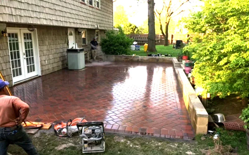 Paver patio beside a house