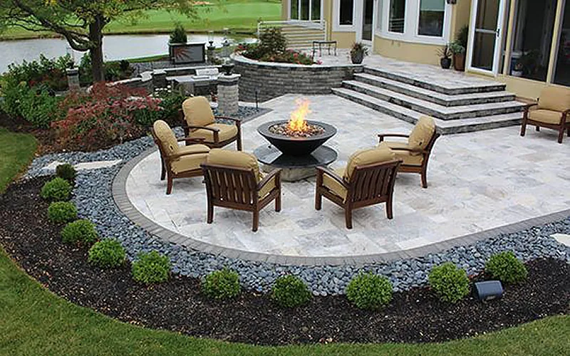 Paver patio with outdoor seating and a fire pit